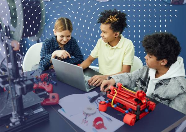 Kids in robotics class on computer